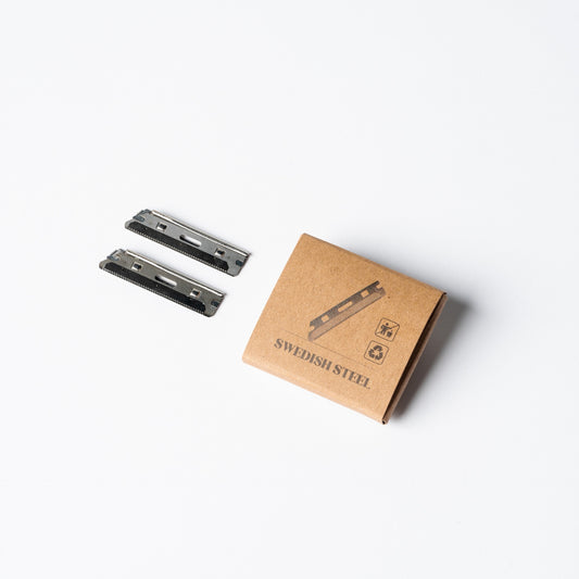 Two stainless steel replacement razor blades for Ruler Precision Razor, angled view